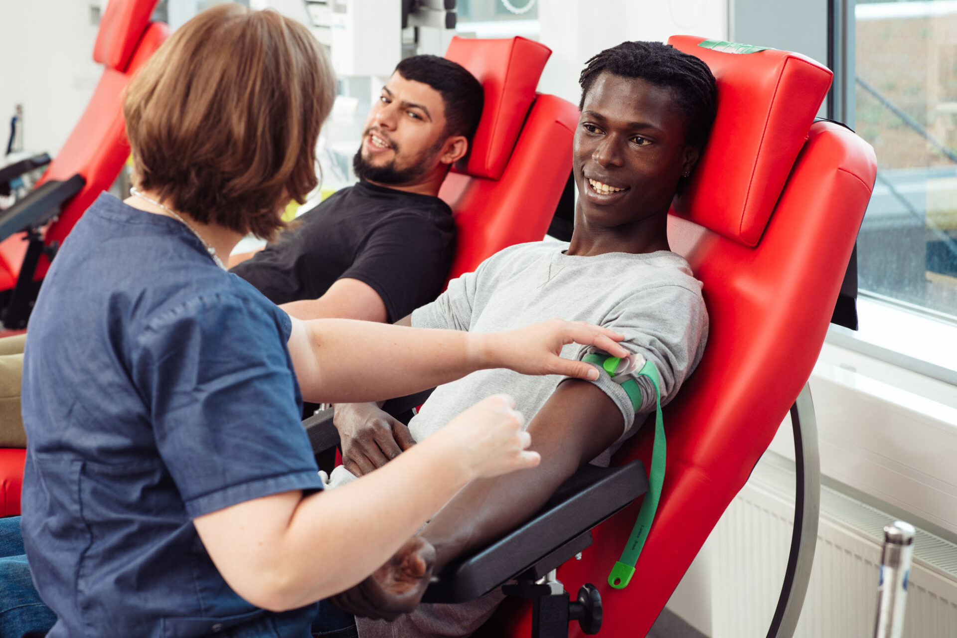 two men are donating blood